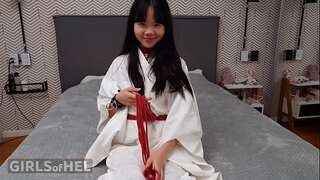 Baebi Hel opens gams wide attempting on leather restrain bondage gear