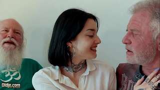 Young brunette has threesome with elder men and she gulps cum