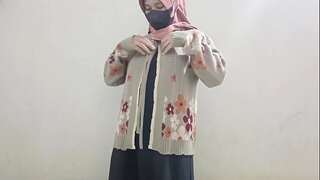 Hijab girl jacks using cucumber
