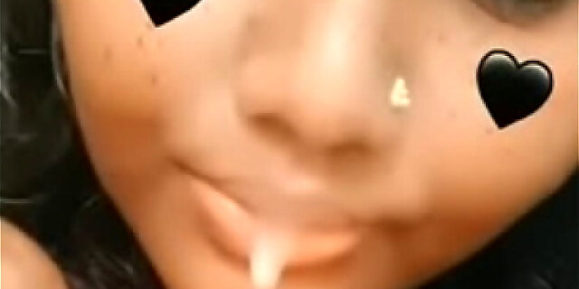 Some indian lady sucking a carrot