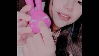 Curious dame masturbating with a bunny toy