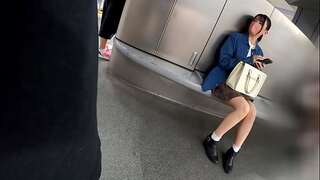 A woman (in her 20s) with lengthy shiny black hair roams around town at　Shibuya [neat and tidy / ebony hair / ponytail / mini-skirt / humid legs / beautiful legs